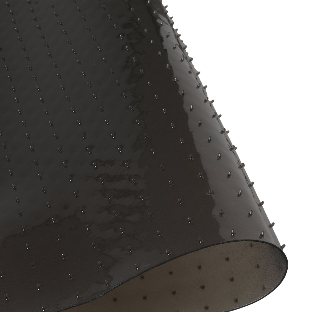 Black PVC chair mat designed for home and office use, featuring a notched stud design for grip and a thickness of 5mm for floor protection.